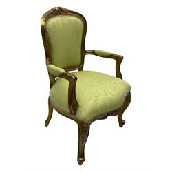 Late 20th century French design gilt framed armchair, upholstered in lime green damask fabric, arched back with carved crest, scroll arms, serpentine front rail, on cabriole front supports with ball feet