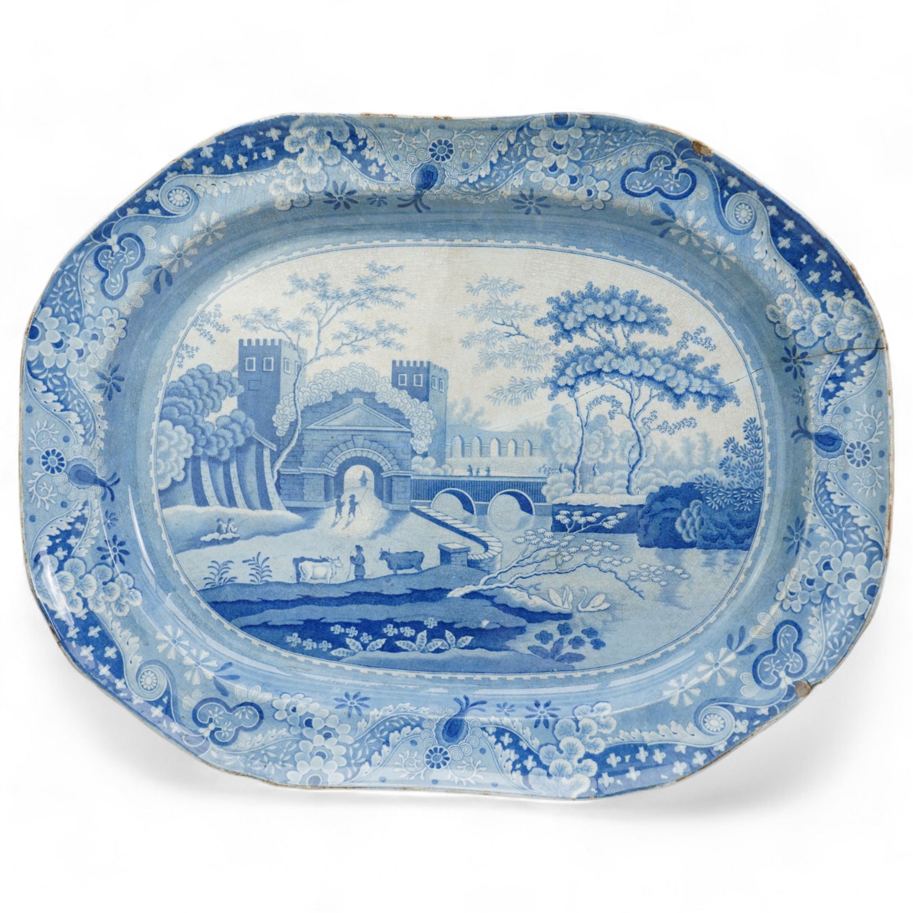 Early 19th century J & R Clews blue and white transfer printed meat plate, decorated in the Castle Pattern, L54cm, another decorated in 'The Villager' pattern, attributed to Turner, another meat plate and small oval stand (4)