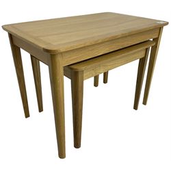 Contemporary light oak nest of two tables, rectangular top over tapering supports