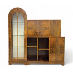 Early 20th century Art Deco figured walnut drinks cabinet, showcasing an asymmetric design...