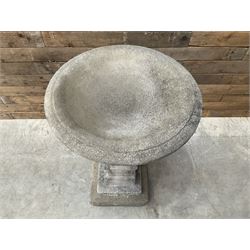 Cast stone garden bird bath, circular dished top, raised on square tapering column, on stepped base with separate mounting plinth