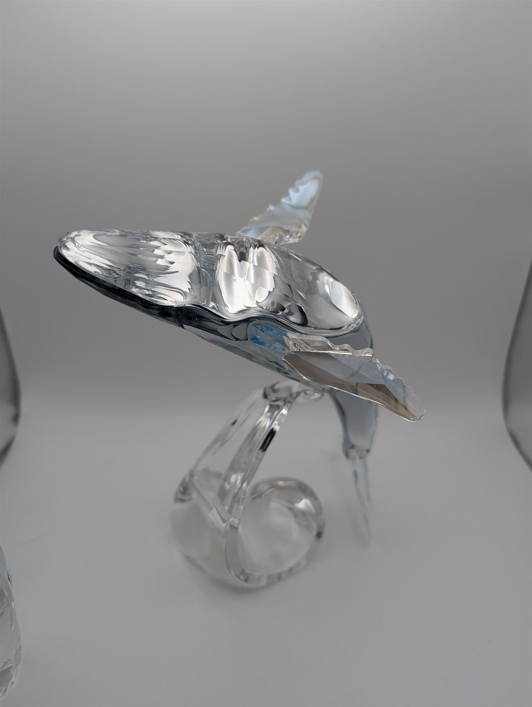 Swarovski Crystal humpback whale, Paikea, with crystal name plaque and a Swarovski Crystal penguin, whale H16cm