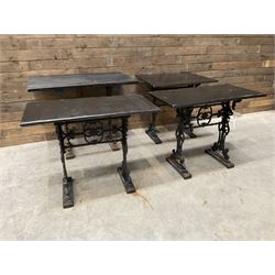 Four cast iron pub or bar tables with rectangular tops