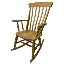 Farmhouse style beech rocking chair, shaped cresting rail on vertical slats, on turned front supports joined by swell-turned double H stretcher base