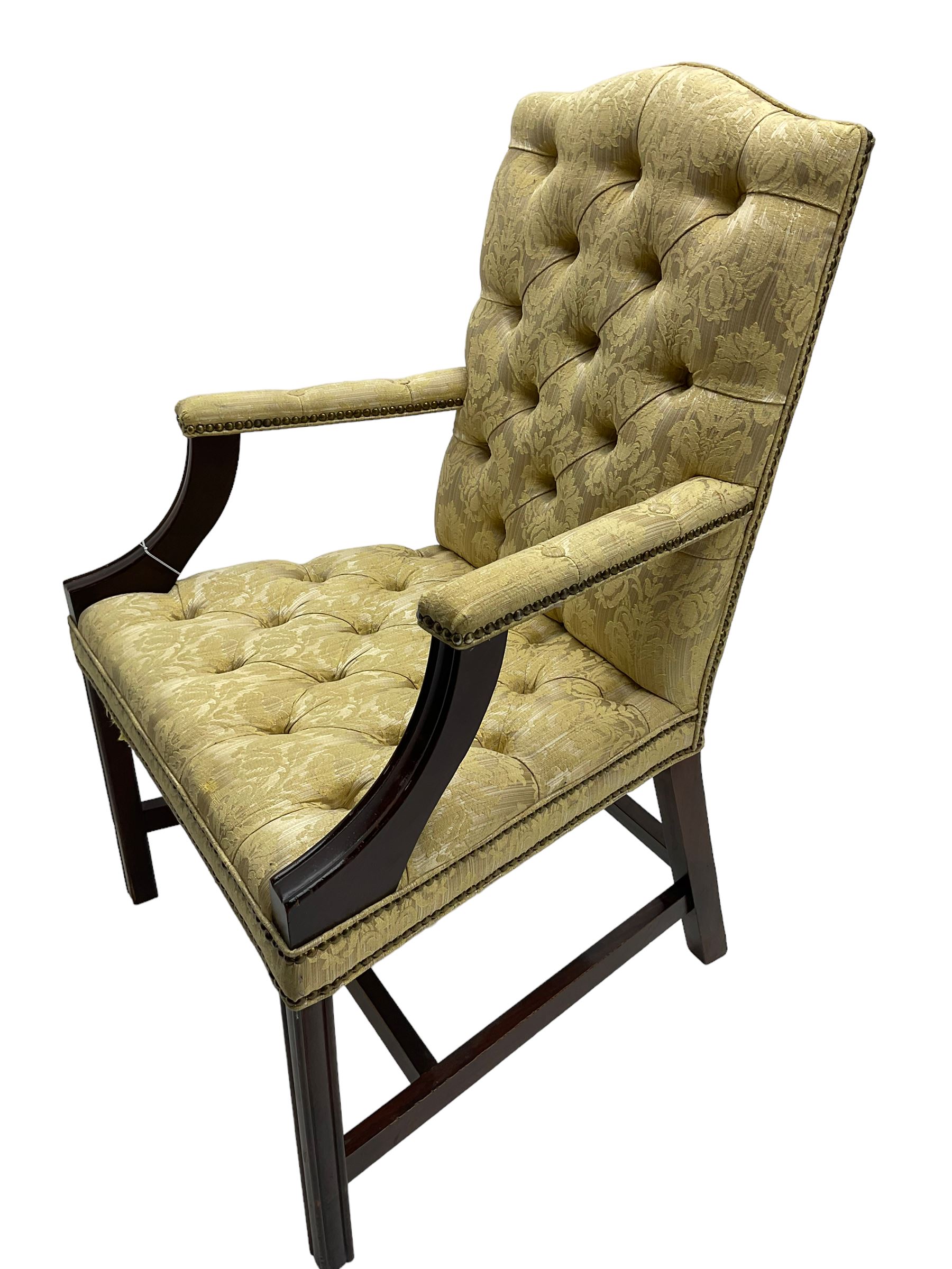 Georgian design mahogany framed Gainsborough open armchair, upholstered in pale gold buttoned fabric with floral pattern, on square moulded supports united by plain stretchers 