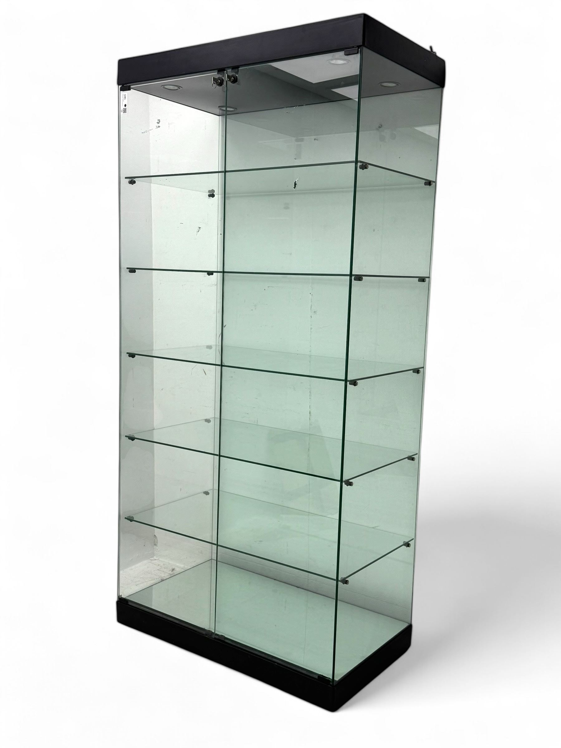 Glazed shop display cabinet fitted with two doors, six shelves with illuminated interior