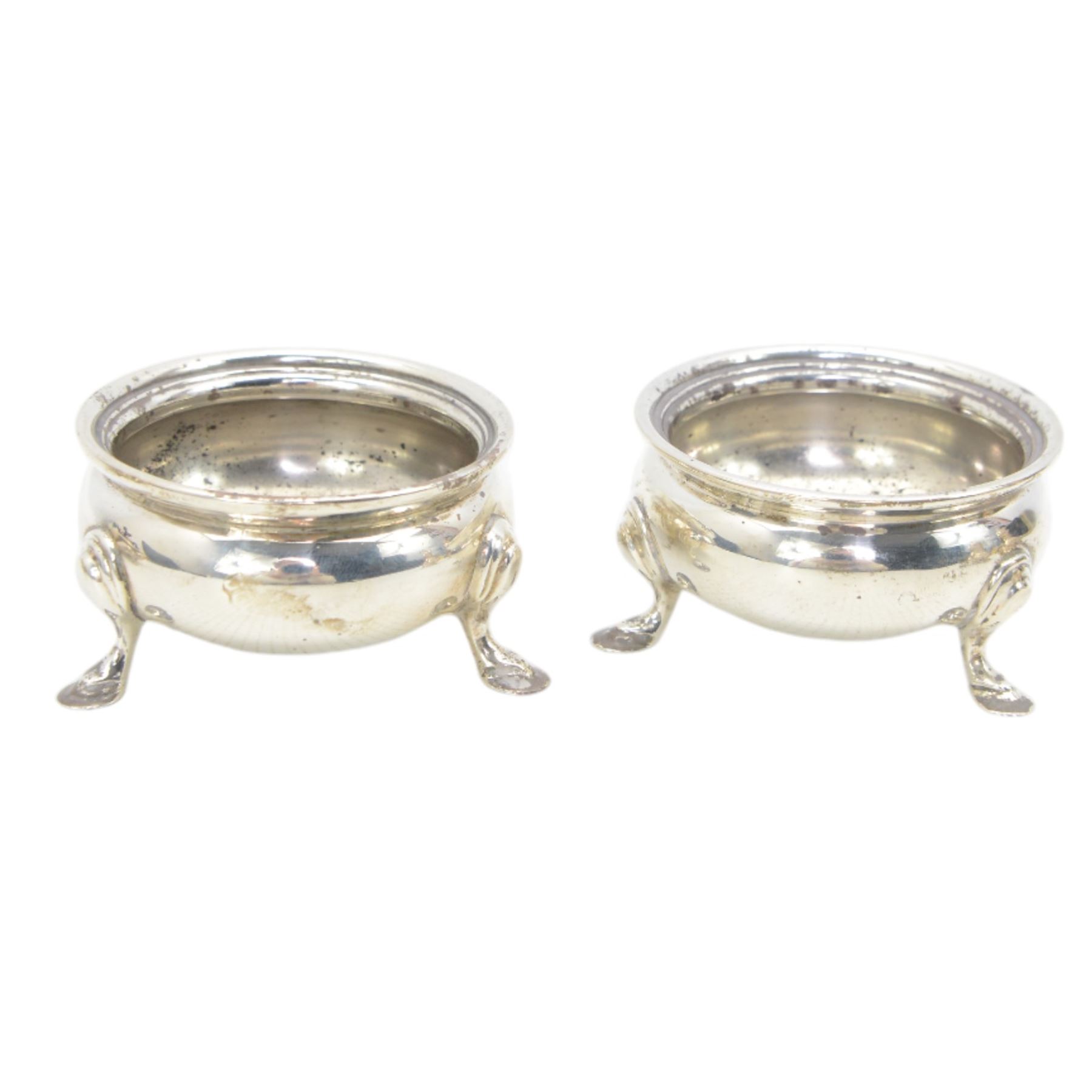 Silver double condiment set comprising pair of salts, pair of pepperettes and pair of mustards with hinged lids all on shaped supports London 1937-40 marked for W Greenwood & Sons