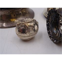 Group of silver, comprising silver mounted trinket box with pin cushion lid, bottle coaster with turned wooden centre, napkin ring, fish trinket box and a small 800 silver model of a boat, all stamped or hallmarked 