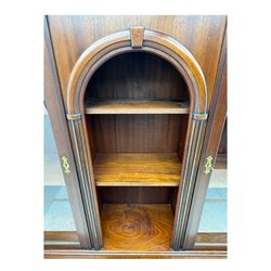 Georgian design mahogany bookcase on cupboard, projecting moulded and dentil cornice, two display cabinets enclosed by glazed doors above over three drawers and three cupboards, on bracket feet