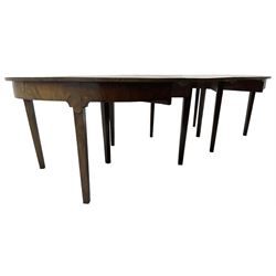 George III mahogany extending dining table, two D-ends with two leaves, on square tapering supports