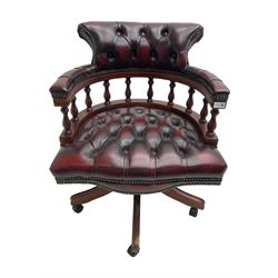 Victorian design Captains swivel desk chair, tub shaped balustrade back, upholstered in deep buttoned oxblood leather with studwork border