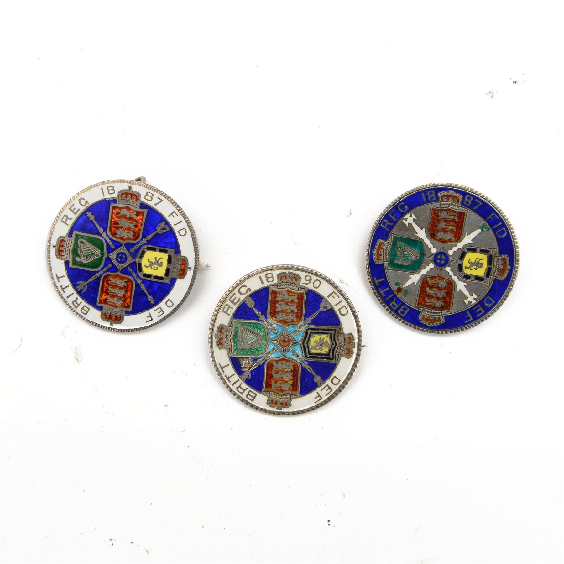 Three Queen Victoria enamelled silver double florin coins, dated two 1887 and 1890, all with brooch mounts