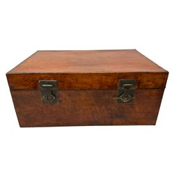 Chinese leather bound and wooden trunk, fitted with metal locks and twin carrying handles, on ebonised stand 