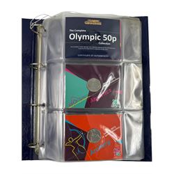 The Royal Mint United Kingdom 'London 2012 sport collection' comprising twenty-nine commemorative 2011 fifty pence coins, including 'Aquatics', 'Archery', 'Athletics', 'Badminton', 'Basketball' etc, all on official card, housed in a Change Checker ring binder 