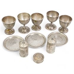 Middle Eastern items comprising five egg cups, pair of pepperettes and four small saucers and a 925 silver pill box