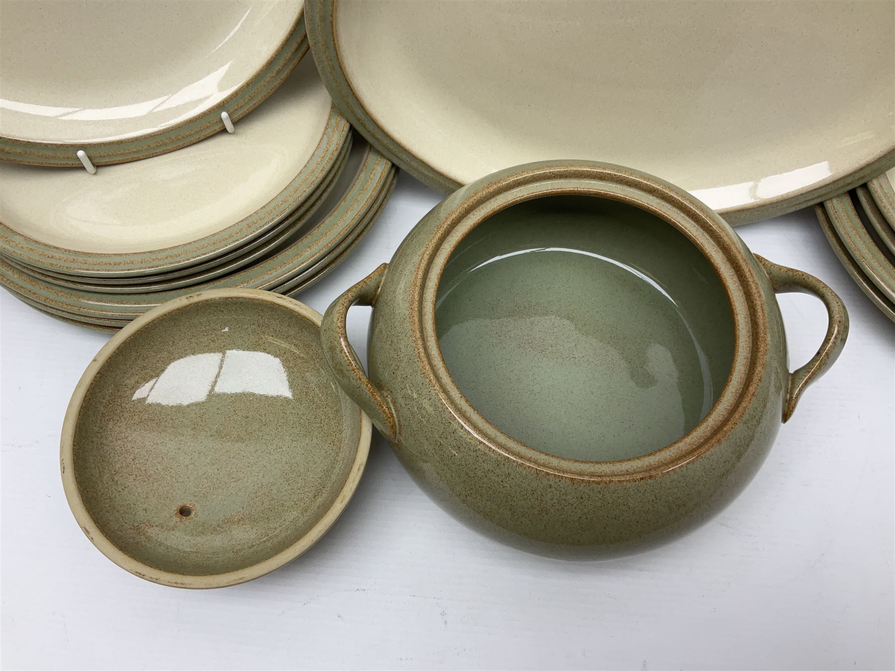 Denby tea and dinner wares, including bowls, jugs, tureens, side plates, dinner plates, serving dishes, cups and saucers, coffee pot, etc, all decorated with a green and brown mottled glaze, with printed marks beneath, in two boxes 