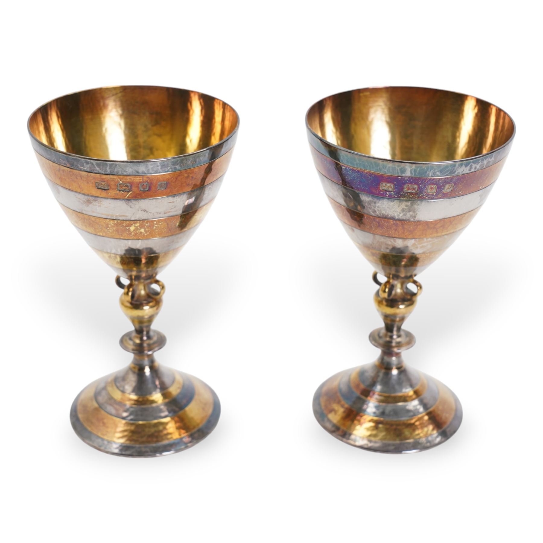 Pair of silver goblets decorated with alternating silver and silver gilt banding with gilded interior on a pierced stem and circular dished foot H14cm London 1970 Makers mark HA