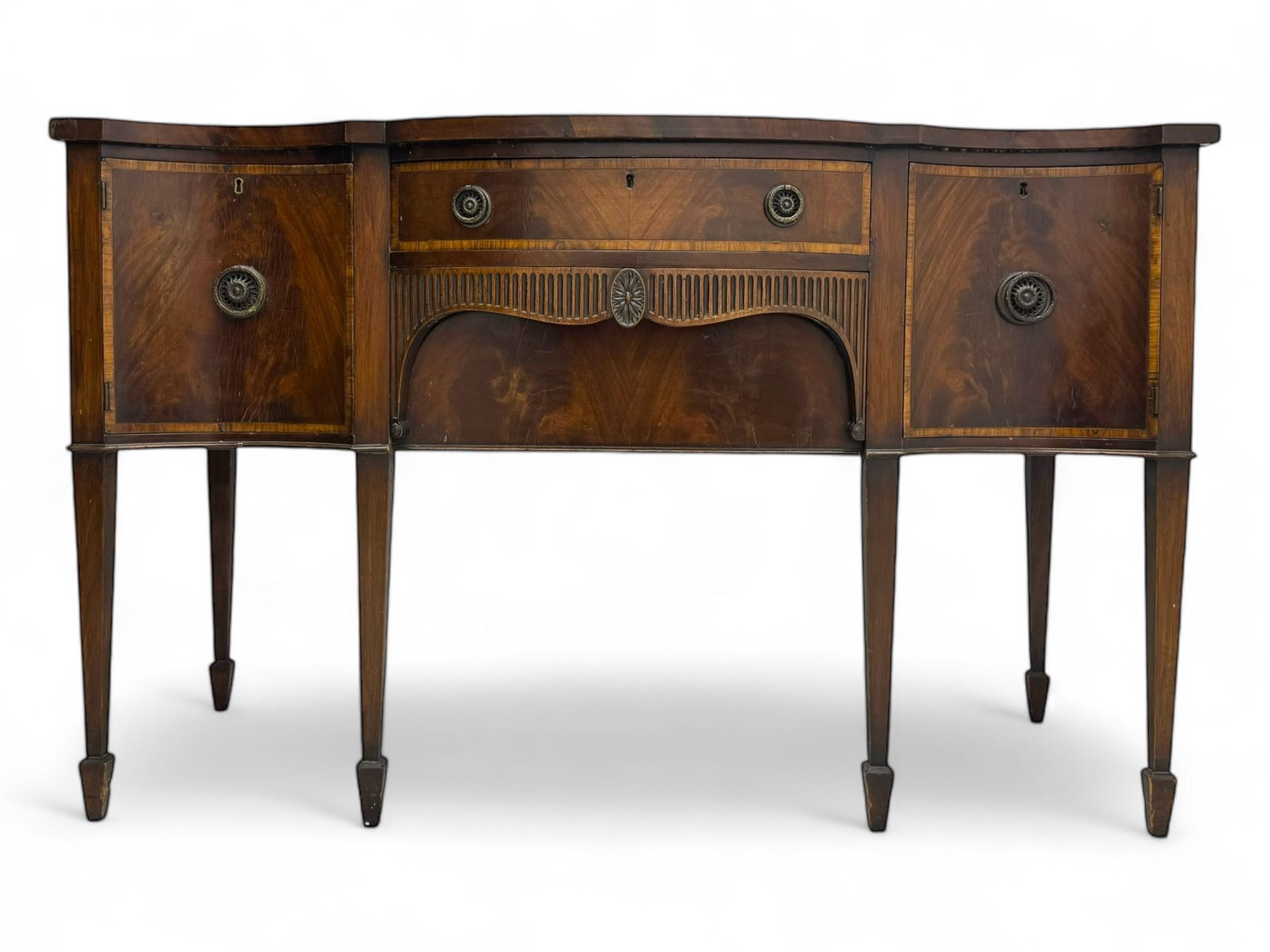 Early 19th century serpentine sideboard, fitted with two cupboards and two drawers, on square tapering supports with spade feet