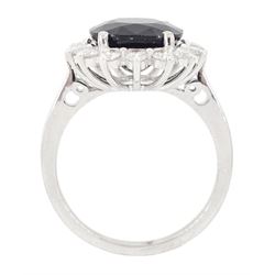 18ct white gold sapphire and round brilliant cut diamond cluster ring, stamped 750, sapphire 5.05 carat, total diamond weight 0.64 carat