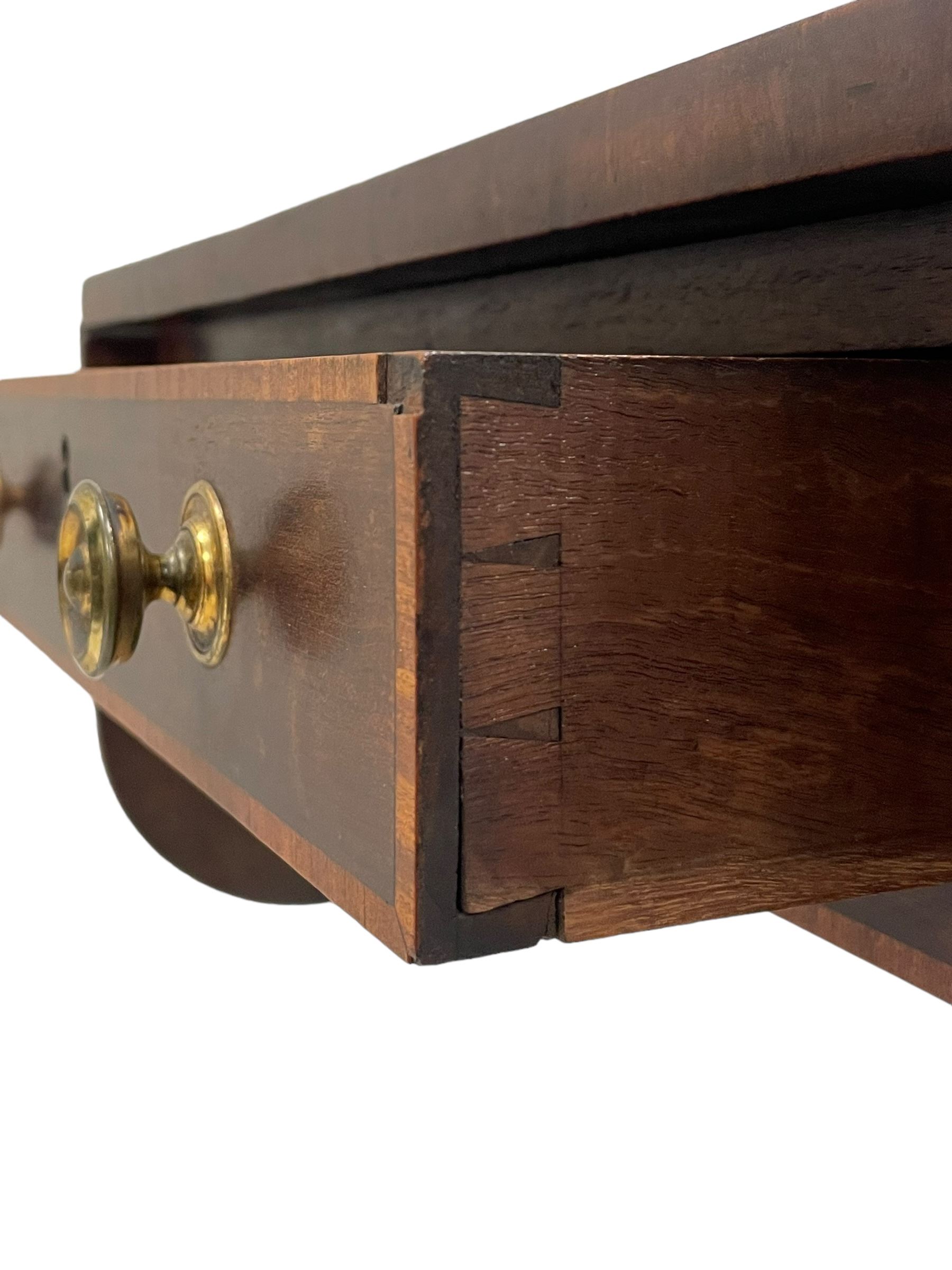 Early 19th century mahogany Pembroke table, rectangular drop-leaf top with rounded corners inlaid satinwood bands, single end drawer and opposing false drawer, turned pedestal on four acanthus carved and reed moulded splayed supports, cast brass cups and castors 