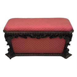 19th century rosewood and simulated rosewood ottoman footstool, tapering canted rectangular form enclosed by hinged lid, upholstered in red fabric, the frieze decorated with scrolling leaves, each corner with scrolled acanthus leaf supports, projecting shallow gadroon moulded edge 