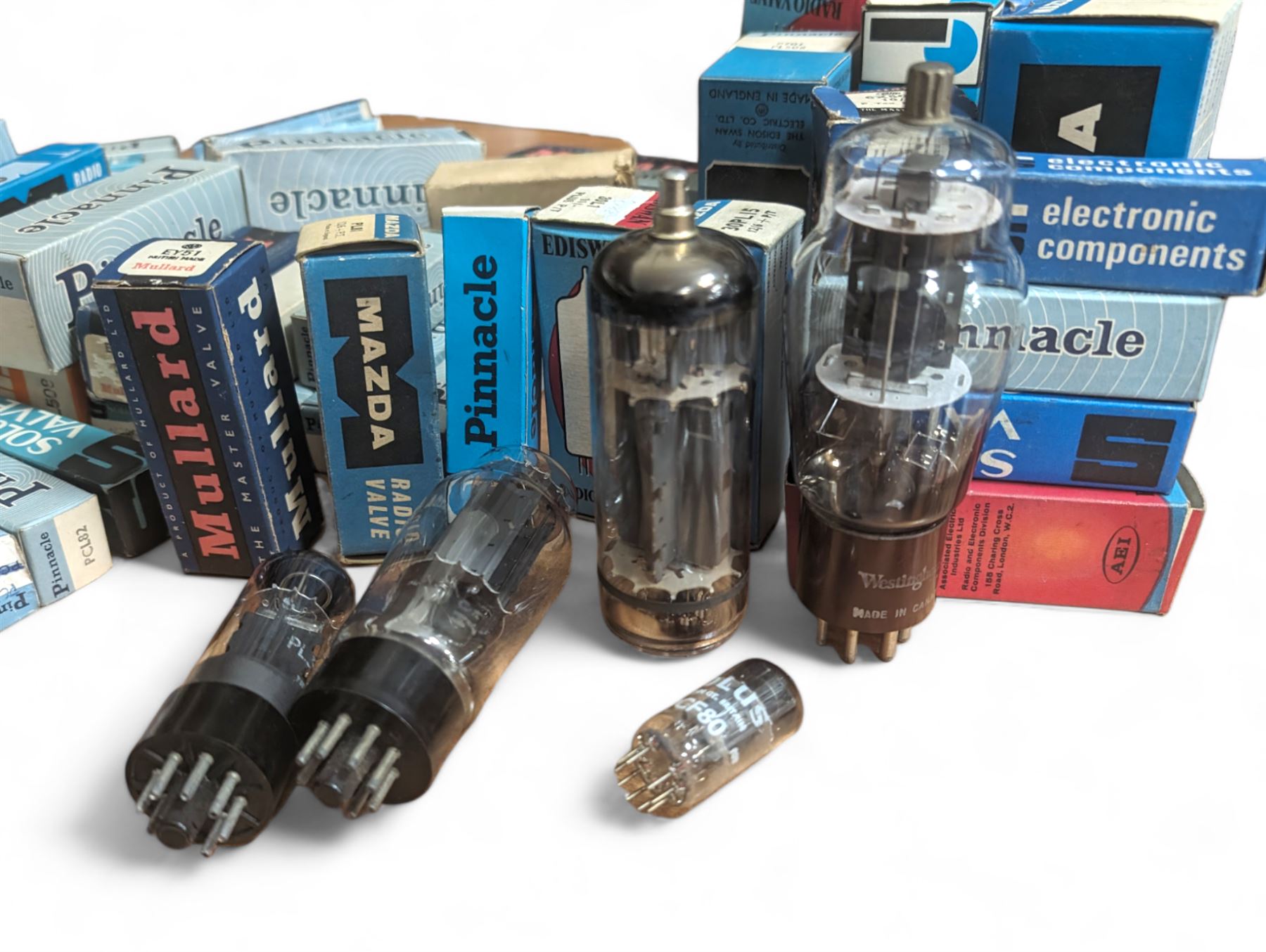 Large collection of thermionic valves/vacuum tubes, by various makers, mostly wrapped in bubble wrap with identifying stickers, together with a collection of empty valve boxes including Pinnacle, Mullard etc