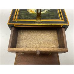 Small wooden collectors chest, painted to each side with birds upon a black ground within red and yellow borders, opening to reveal a compartmentalised interior containing one long drawer above two smaller drawers, H13cm, W18cm, D14.5cm