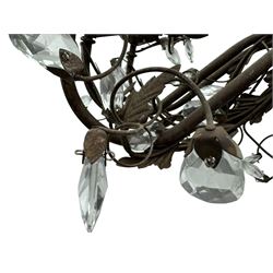 India Jane Interiors - contemporary wrought iron chandelier, adorned with vine and leaf motifs intertwined with faceted glass crystal drops, curved arms supporting six candle-style light fittings, the central stem terminating in a suspension loop