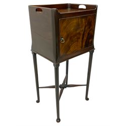 20th century Georgian design mahogany bedside pot cupboard, pierced tray top, enclosed by single figured door, on cabriole supports united by turned X-framed stretchers 