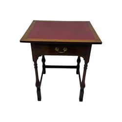 Early 20th century oak walnut lamp or side table, rectangular top with red leather insert, over single drawer with felt lining and brass handle, raised on turned supports with stretchers