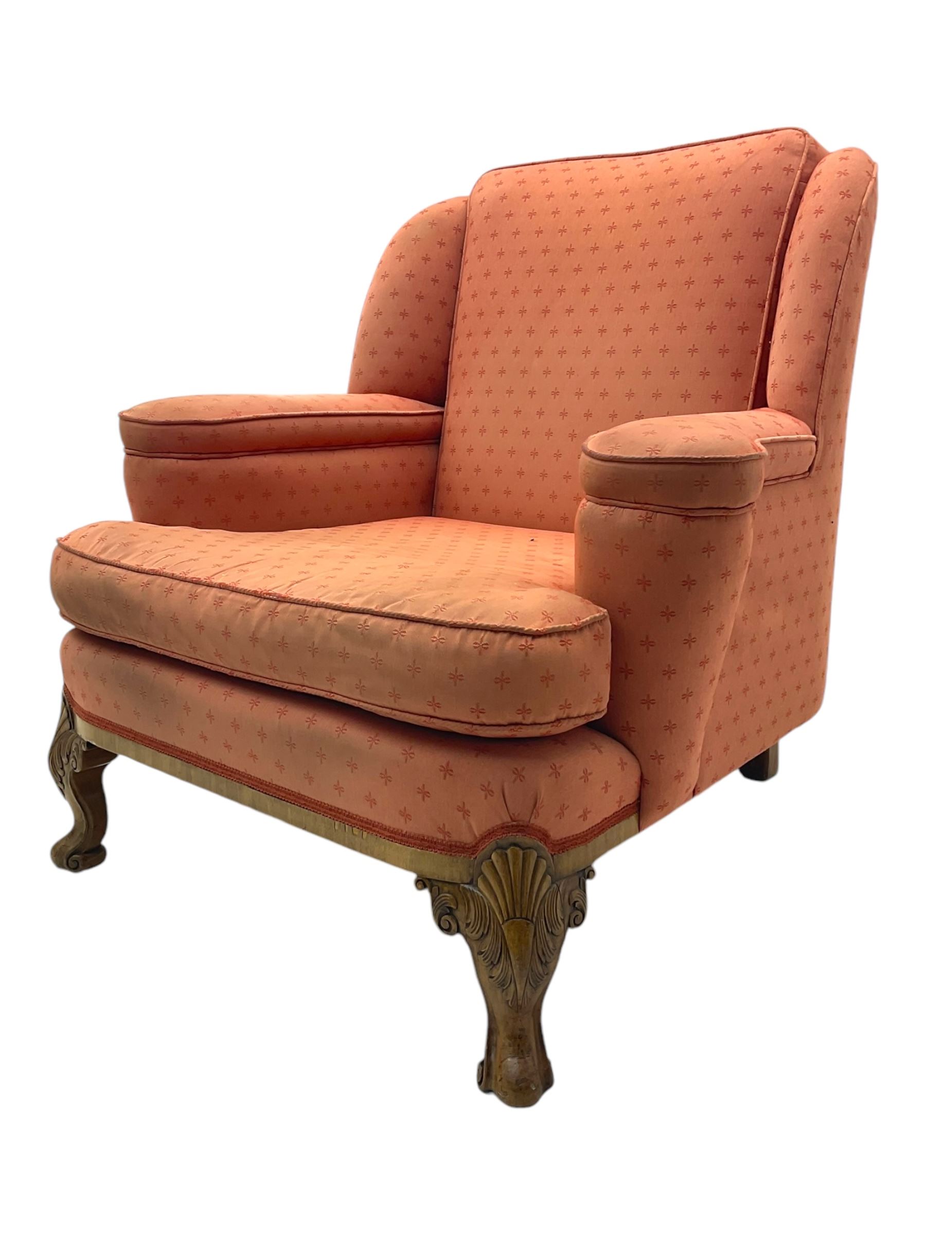 Late 20th century mahogany framed three seat sofa, upholstered in cream fabric with repeating cross pattern, raised on cabriole supports (W192cm, D98cm, H89cm); matching armchair in light pink fabric (W92cm, D98cm, H89cm) 