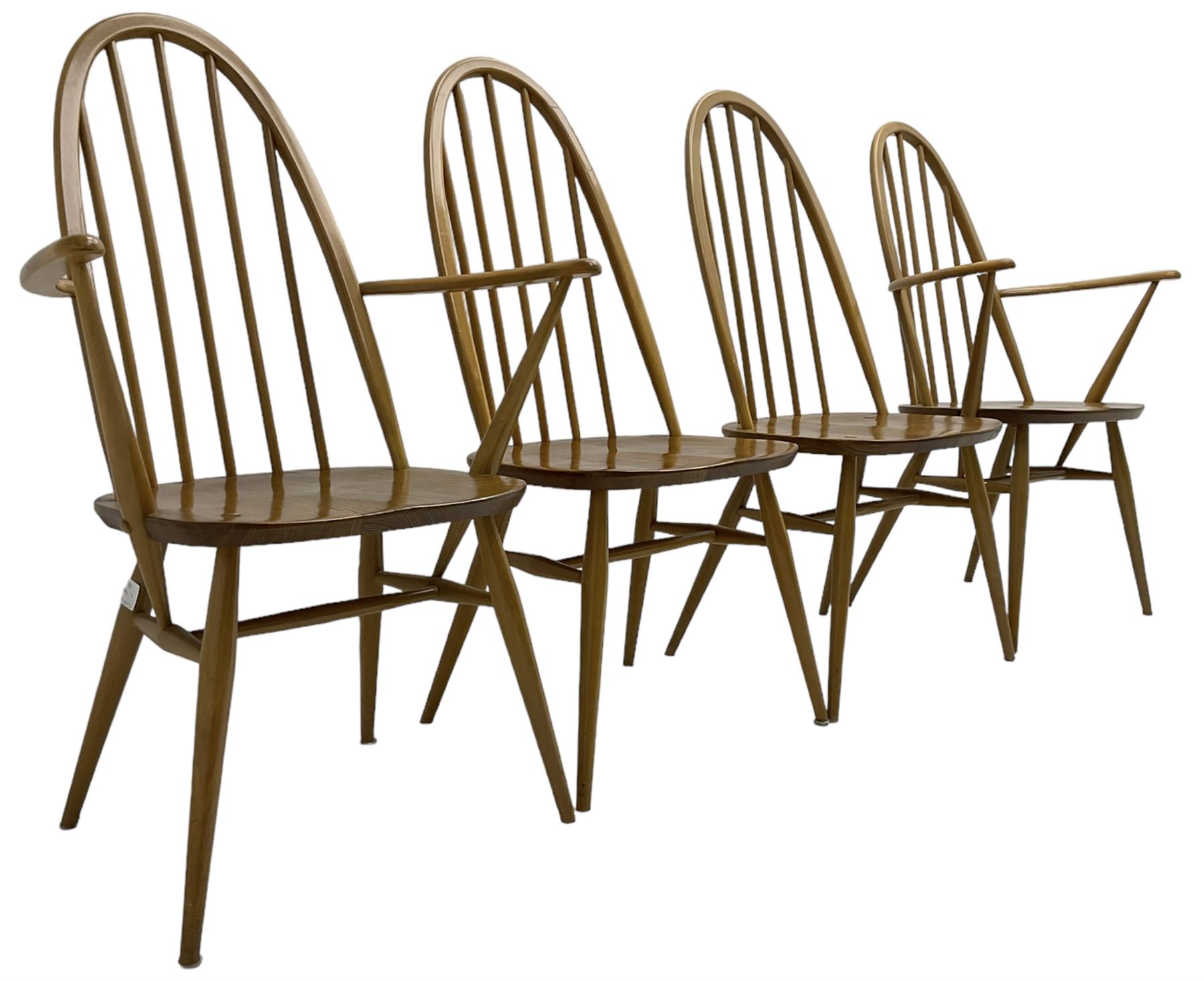 Ercol - light elm and beech set of ten (8+2) 'Quaker Windsor' dining chairs, high hoop and stick back over splayed supports united by H-stretcher, with foliate patterned crimson loose seat cushions