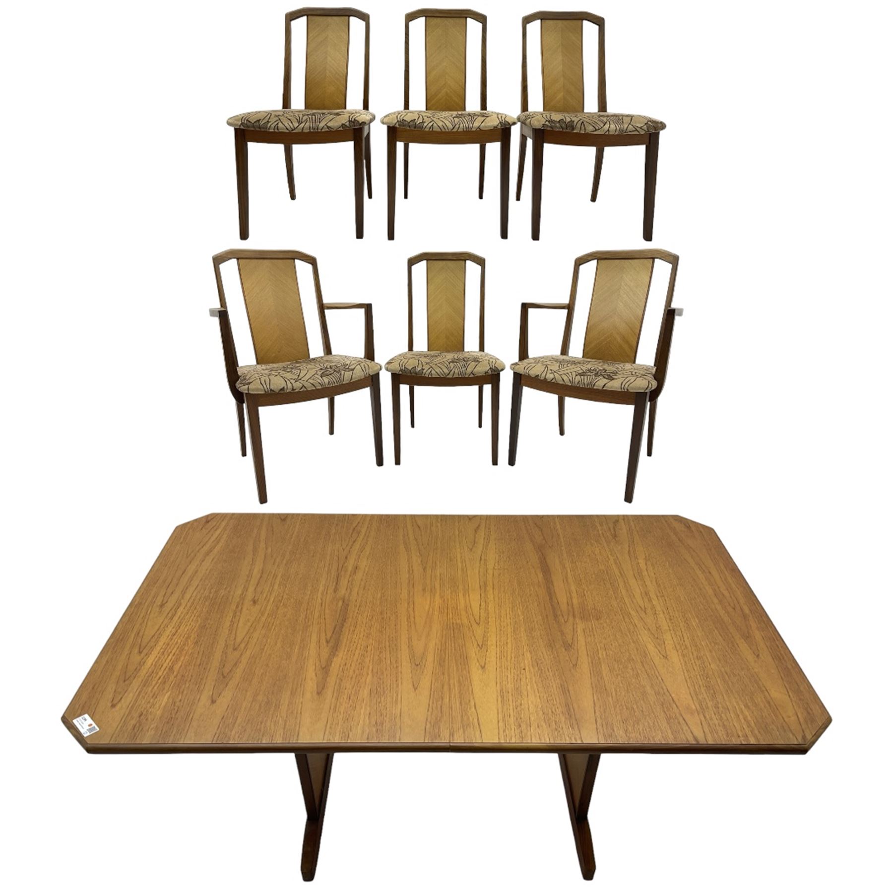 G-Plan -  1970s teak extending dining table, pull-out extending action with fold-out leaf, rectangular end supports on sledge feet united by stretcher (100cm x 160cm - 205cm, H73cm); set of six dining chairs, chevron-patterned backrests upholstered with floral patterned fabric, on tapered legs, H89cm