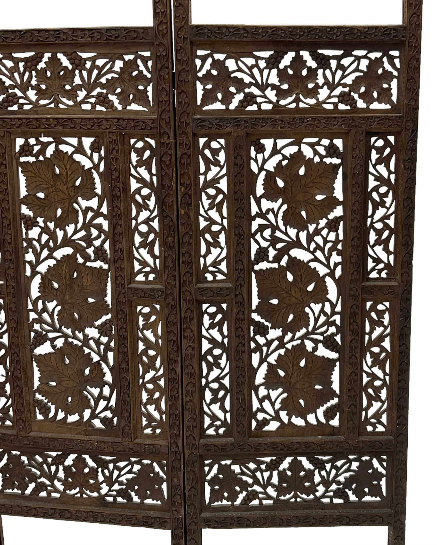 Anglo-Indian heavily carved and pierced three panel folding screen 