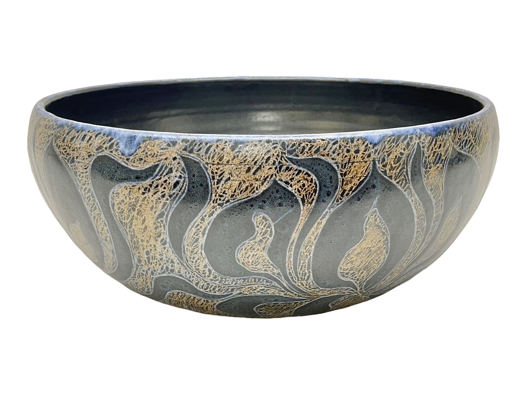 John Egerton (c1945-): studio pottery stoneware serving dish, decorated with abstract floral petals on a dark blue ground, D30cm