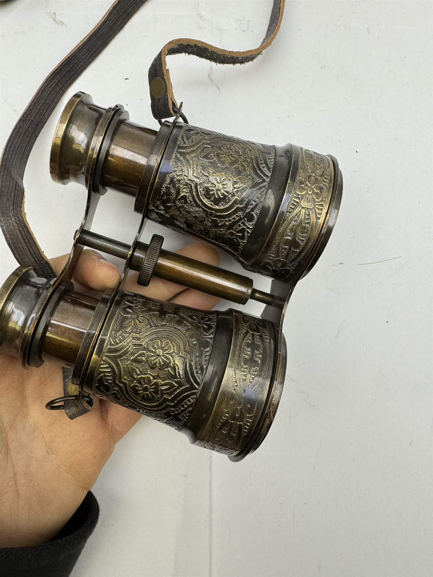 Pair of brass and mother of pearl opera glasses, together with a gilt metal pair of racing binoculars and one other pair, etc 