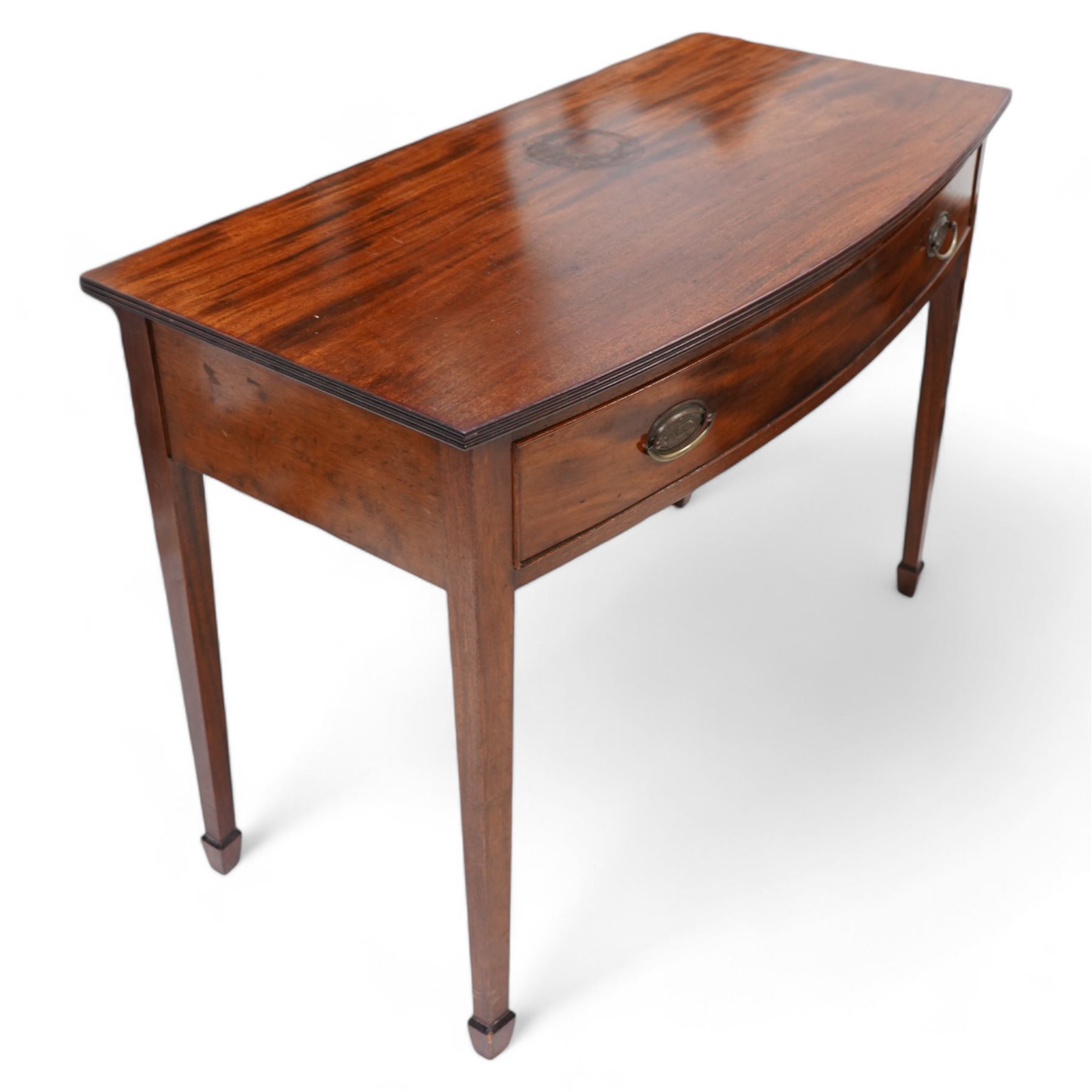 19th century mahogany bow-fronted side table, reeded top over single drawer, on square tapering supports with spade feet