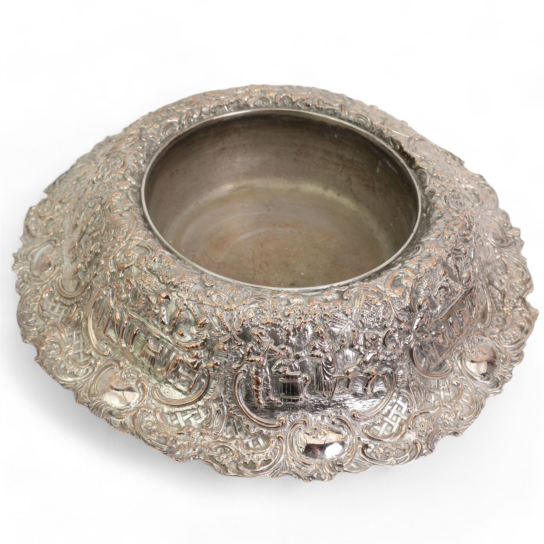 Large 19th century silver plate on copper circular table centre bowl, repousse with tavern scenes, D37.5cm, together with two pairs of silver plate on copper bottle coasters 