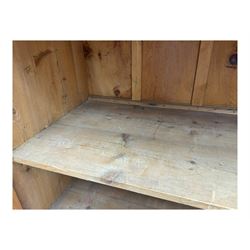 Large 19th century pine cupboard, rectangular top over two panelled later doors, enclosing four open shelves, on plinth base