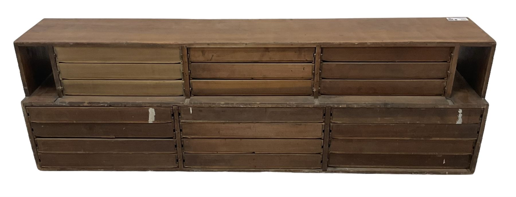 Late 19th century stained beech Solicitor's desktop bank of correspondence drawers, two-tiered, fitted with twenty one drawers, together with related brass plaques