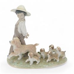 Lladro figure group My Little Explores, modelled as a dog with six dogs, no 6828, with original box 