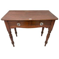 Victorian stained pine side table, fitted with two drawers with glass handles, raised on turned supports