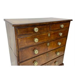 George I walnut chest, moulded rectangular top with book-matched veneers within crossbanding, fitted with two short over four long graduating drawers, moulded drawer fronts with brass handles, on bracket feet, the chest will split into two sections 