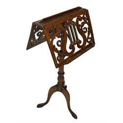 Regency design mahogany duet music stand, double-sided hinged and adjustable reading stands, scrolling leafy branch fretwork with scrolled lyre, fitted with gilt metal reeded columns, on adjustable stem, turned pedestal with tall splayed supports 