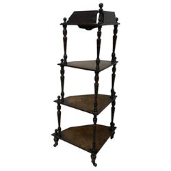 Victorian inlaid walnut corner four-tier whatnot, raised back over four graduating tiers of triangular form, decorated with satinwood and ebony inlays, united by tapering ring turned uprights, on castors