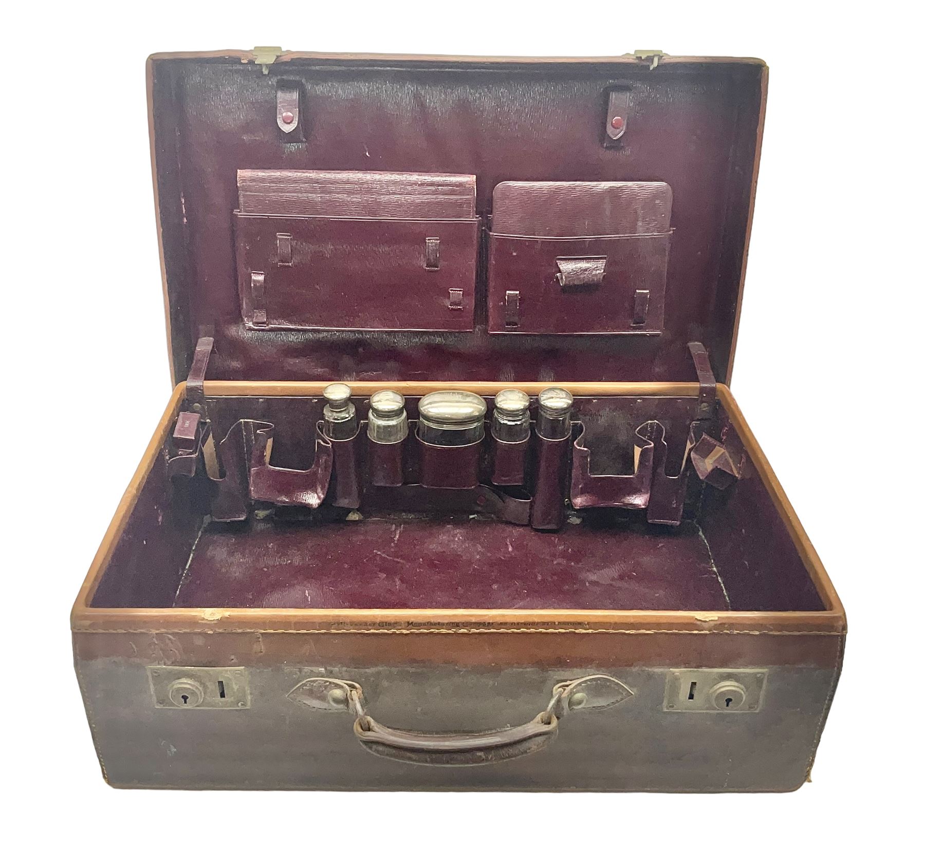 Early 20th century leather bound travelling case, with initials to cover, with fitted interior containing five silver topped glass jars, each engraved with initials, hallmarked The Alexander Clark Manufacturing Co, London 1910 & 1911, case W61cm