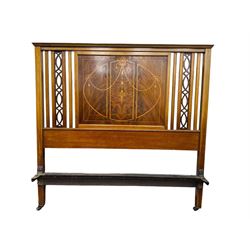 Edwardian mahogany double bedstead, the headboard with central book-matched mahogany panel, decorated with satinwood inlaid swags and ribbons, flanked by openwork carved vertical supports, complete with matching footboard and folding upholstered base