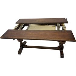 Early 20th century oak extending table, moulded rectangular top, pull-out action with fold-out leaf, on turned cup and cover pedestals and sledge feet, united by moulded stretcher 