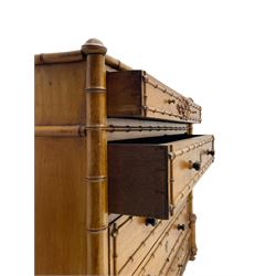 Victorian pine and simulated bamboo chest, fitted with five drawers, the drawer fronts decorated with applied simulated bamboo mounts and turned ebonised handles, on turned front feet