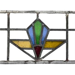 Four early 20th century stained glass and leaded windows, Art Deco design in blue, green, gold and red, largest 67 x 57cm, smallest 19 x 85cm. 